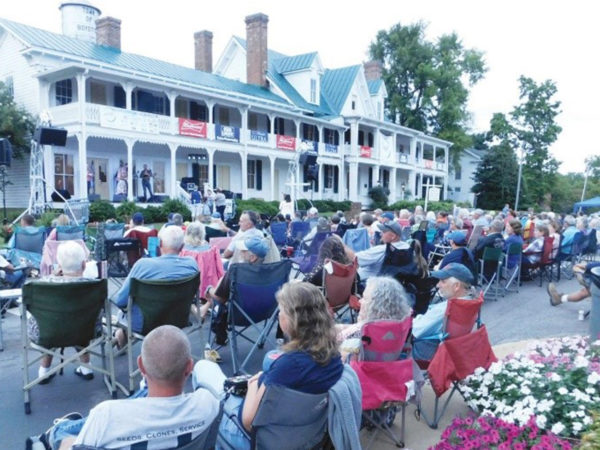 A large audience listening to music at the Boydton Bluegrass Festival