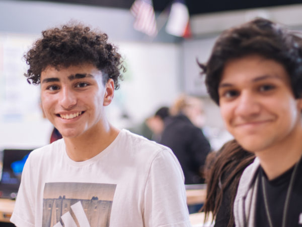 Two young men in a classroom