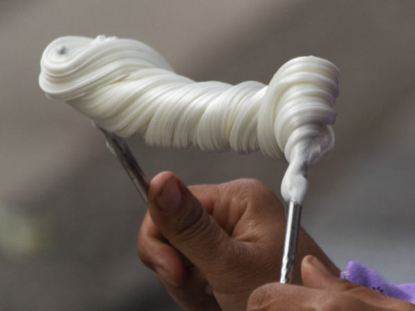 A photo of hands pulling homemade taffy
