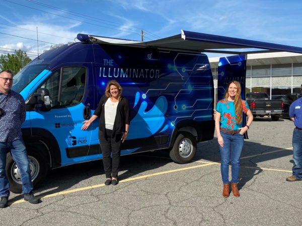 Microsoft team standing in front of a van