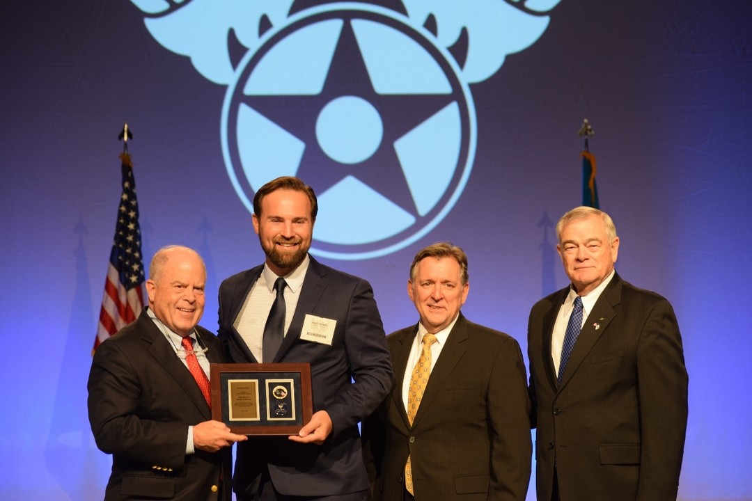 Microsoft's Jim Johnson, second from left, receiving the CyberPatriot Mentor of the Year Award, Saturday, September 15, 2021