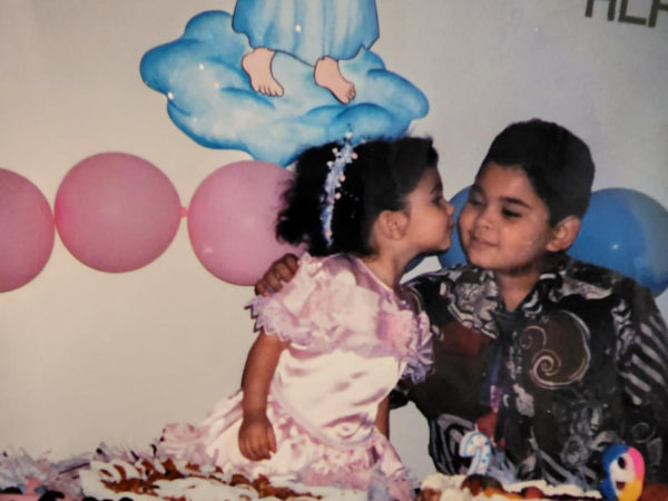 Angelica and her brother Alan, at a birthday party as children