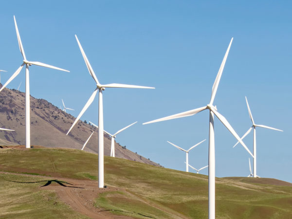 Wind turbines on a dry, barren hillside
