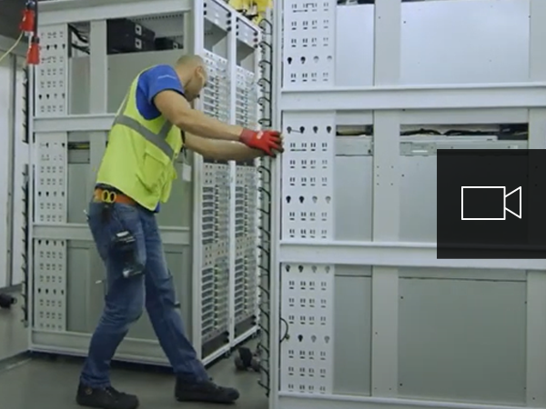 Two men working in a datacenter