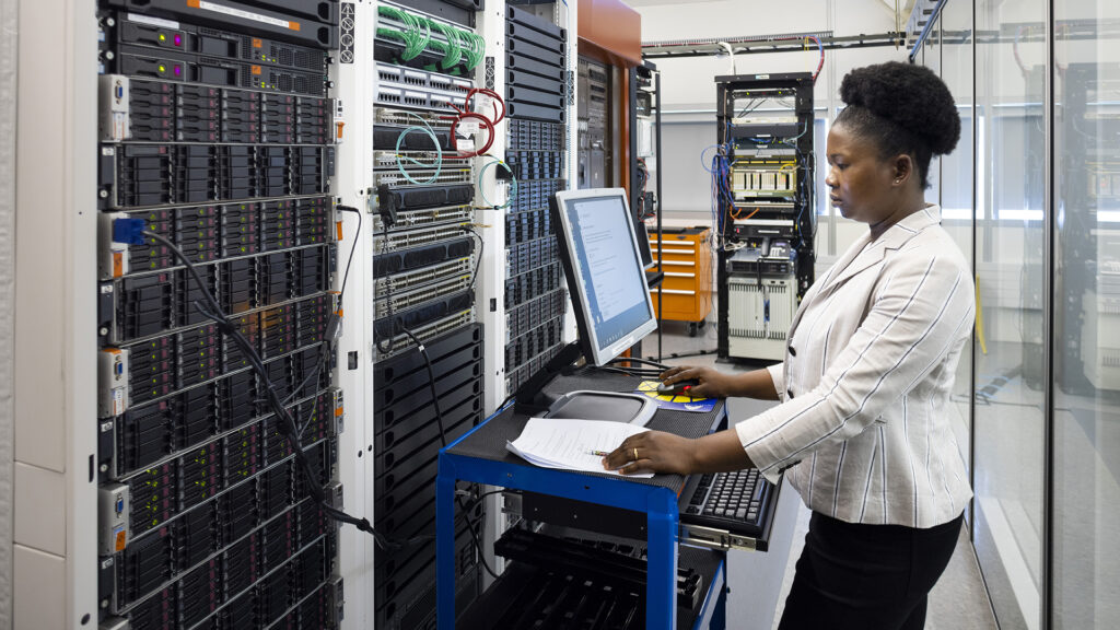 A woman working in a datacenter