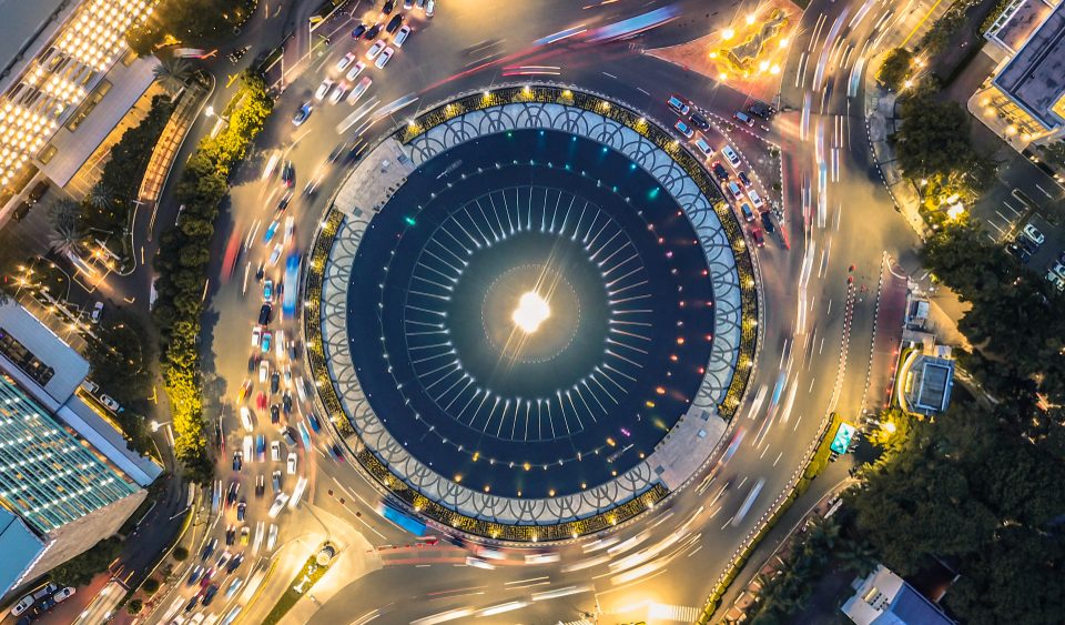 Aerial view of a round building in urban city