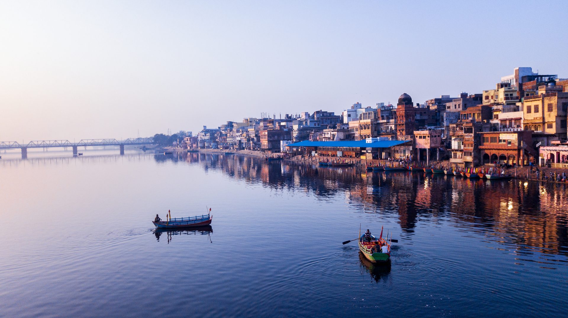 A view over calm water with two small boats