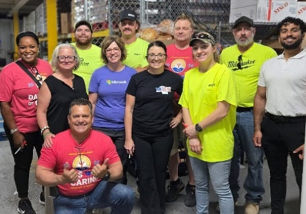 A group of volunteers smiling