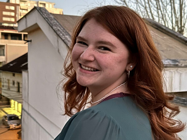 Kayla Blick, smiling over her shoulder