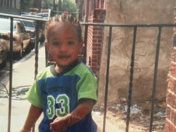 Naim Jones, as a toddler, in an urban town