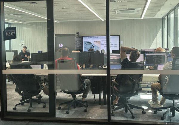 People receiving hands-on training inside a conference room