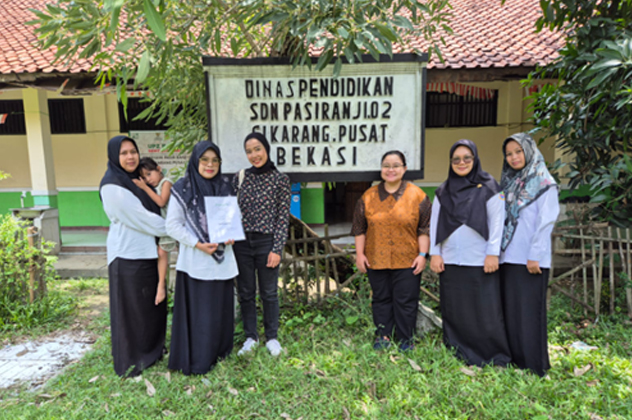 Students standing outside a classroom in Indonesia