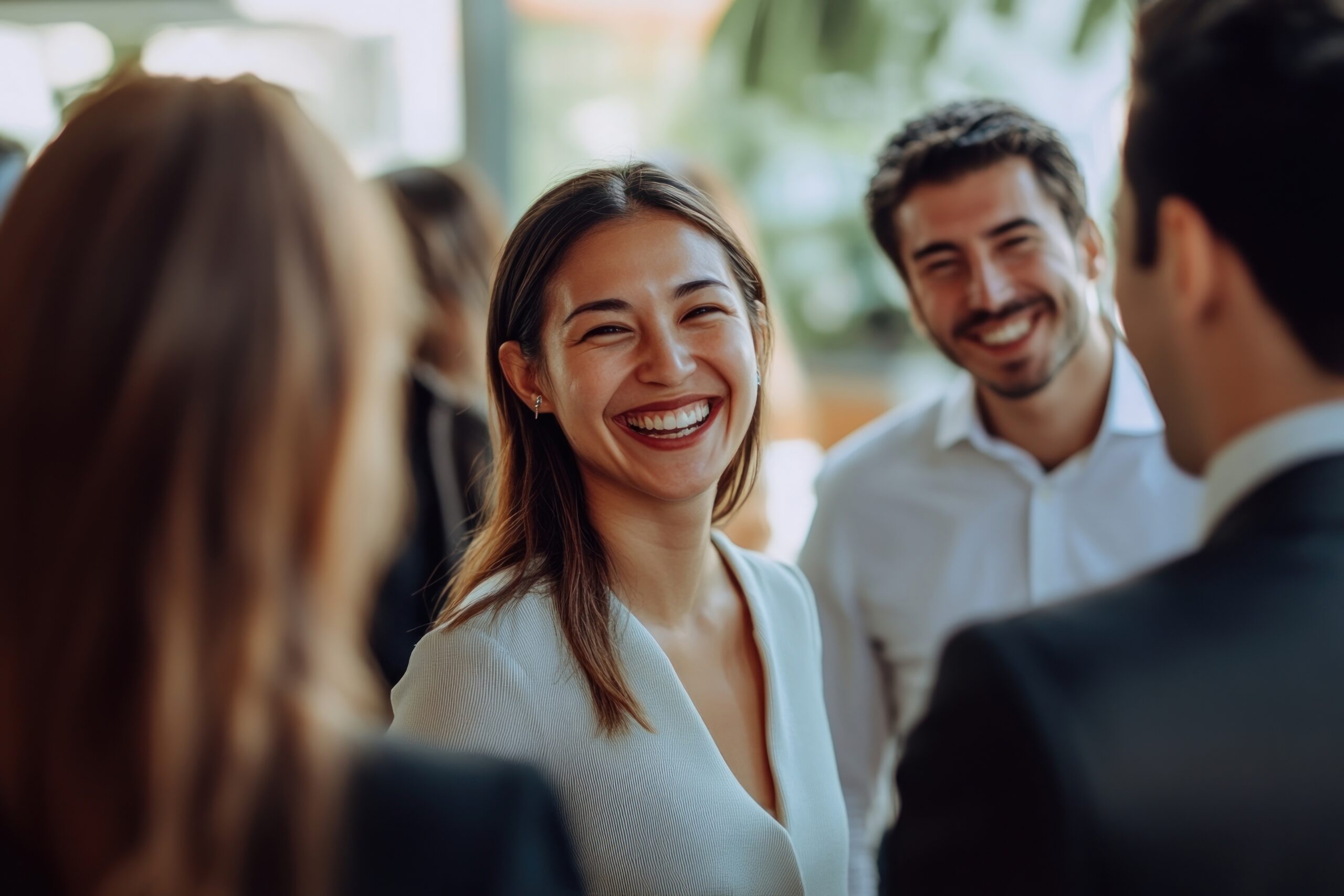 A young group of professionals, talking and smiling