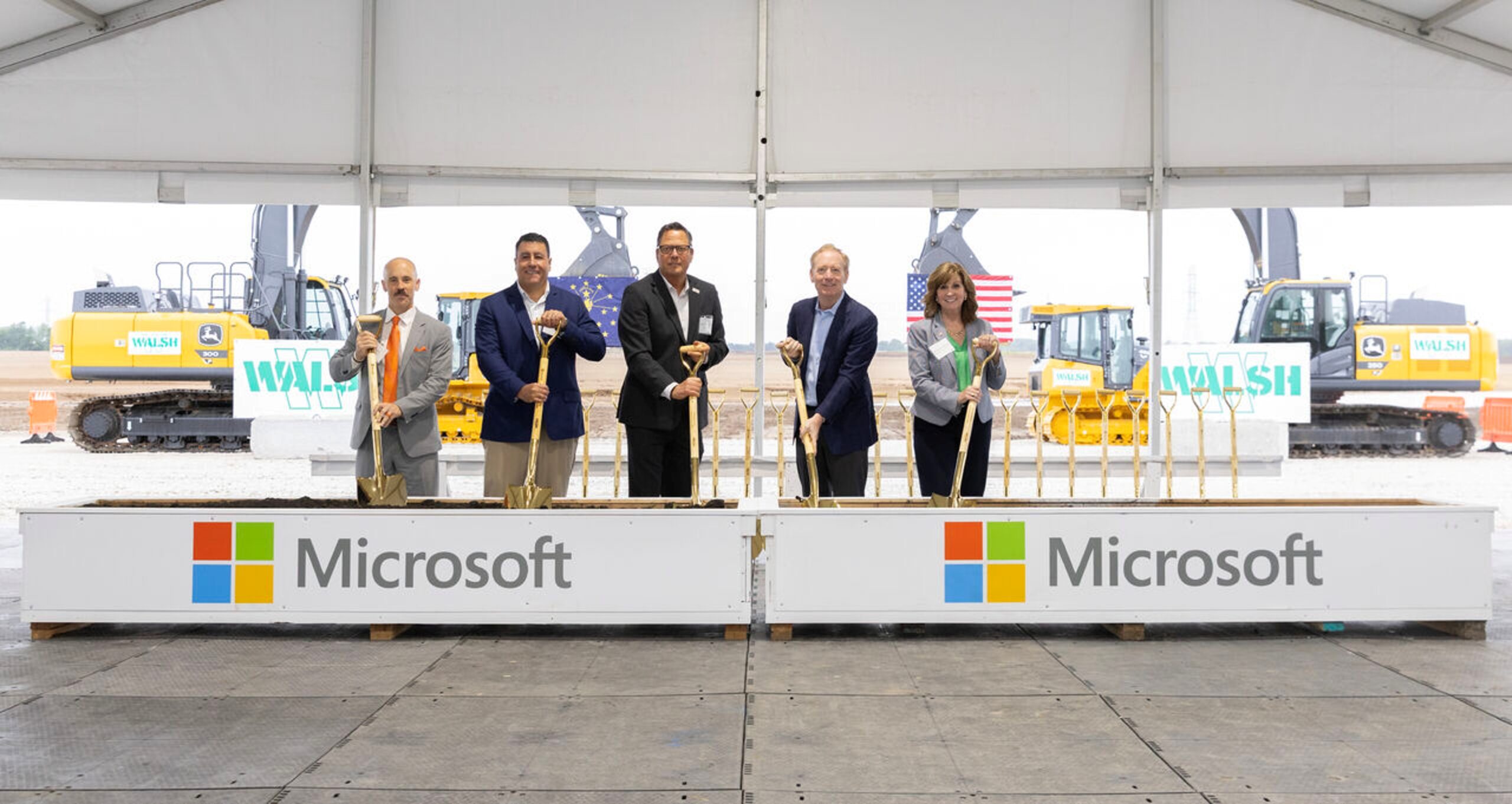 Brad Smith with a group of local leaders standing with shovels at a groundbreaking ceremony